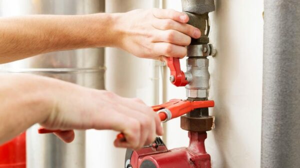 Electrician using multimeter